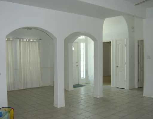 a view of living room and patio