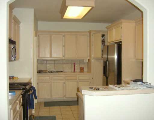 15633 Dyna Street Corpus Christi, TX 78418 - Photo 5 of 8 a bathroom with a granite countertop sink and a mirror