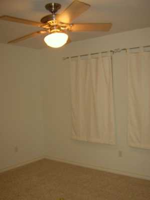 15633 Dyna Street Corpus Christi, TX 78418 - Photo 8 of 8 a bathroom with a shower curtain and a sink