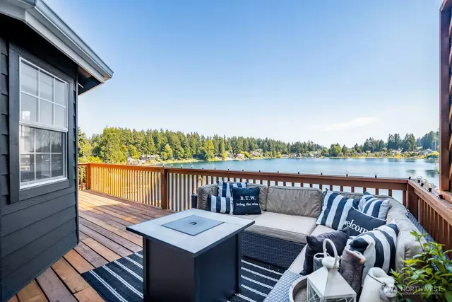 a view of a balcony with two chairs and a table
