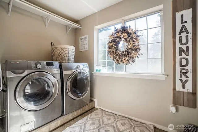 a utility room with dryer and washer