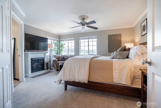 a spacious bedroom with a bed and a fireplace
