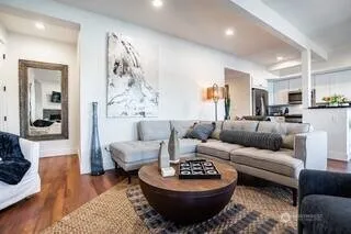 a living room with furniture and a rug