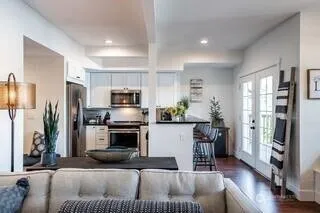 a kitchen with a refrigerator and a stove top oven