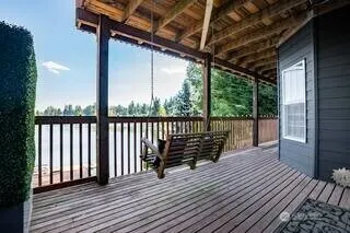 a view of deck with wooden floor and outdoor seating