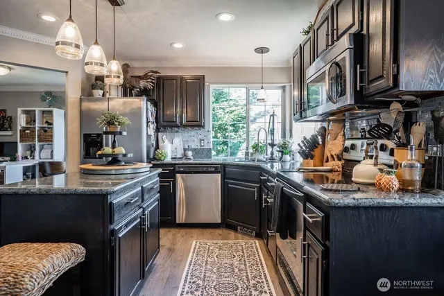 a kitchen with granite countertop lots of counter top space