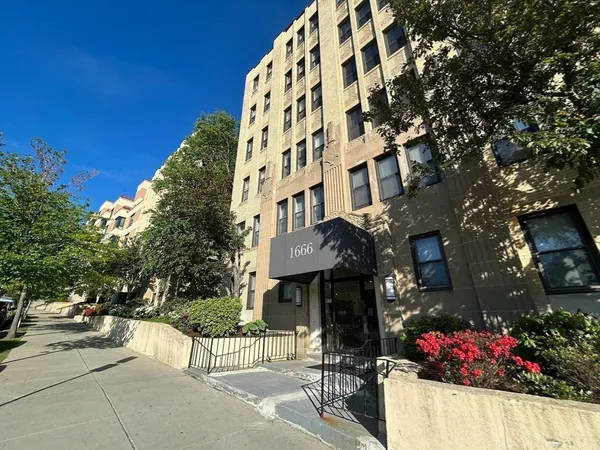a view of a building with a street