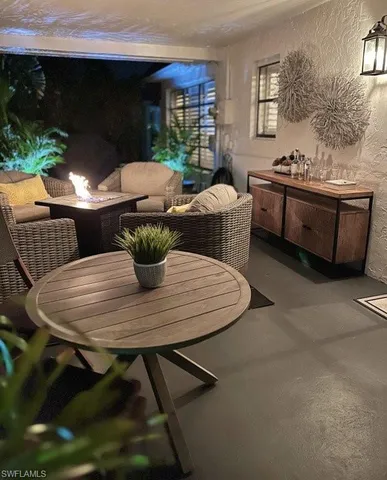 a dining room with furniture and window