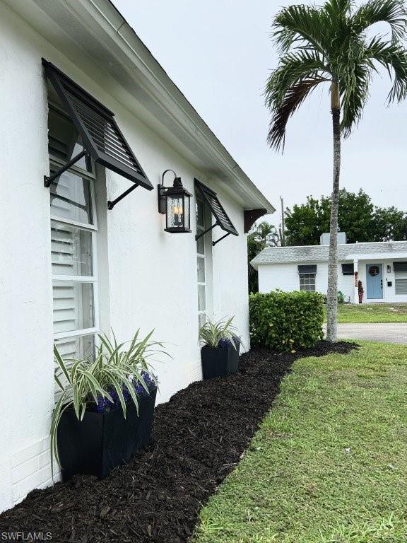 12 Knights Bridge Road, Unit A32 Naples, FL 34112 - Photo 17 of 17 a view of a house with a garden