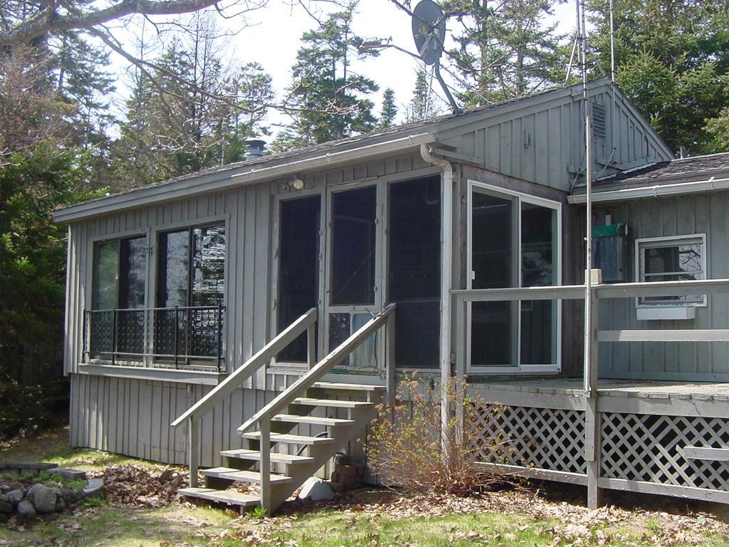 91 Bird Point Road Cushing, ME 04563 - Photo 6 of 14 Back of cottage overlooking the...