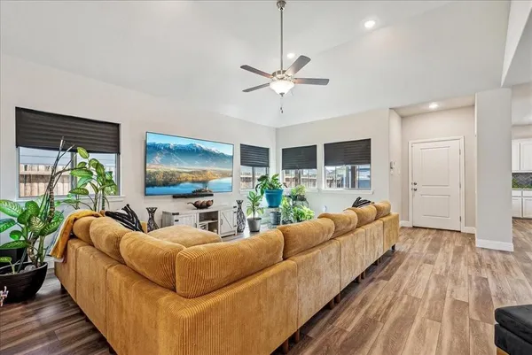 a living room with furniture and a flat screen tv