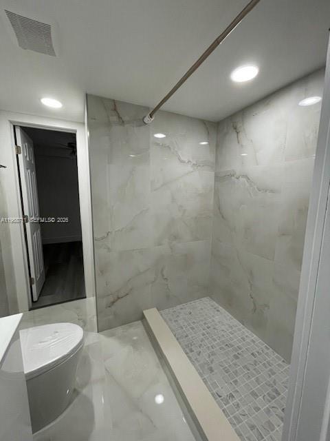 1852 Southwest 7th Street, Unit 203 Miami, FL 33135 - Photo 11 of 16 a bathroom with a granite countertop sink a toilet a mirror and shower