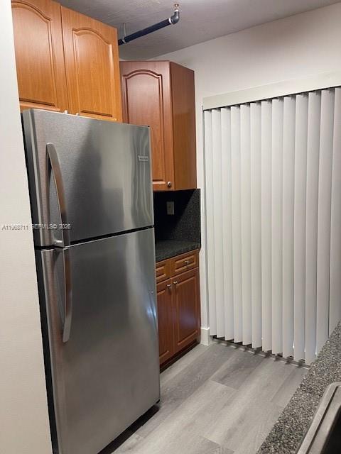 1852 Southwest 7th Street, Unit 203 Miami, FL 33135 - Photo 14 of 16 a view of a refrigerator in kitchen and a window