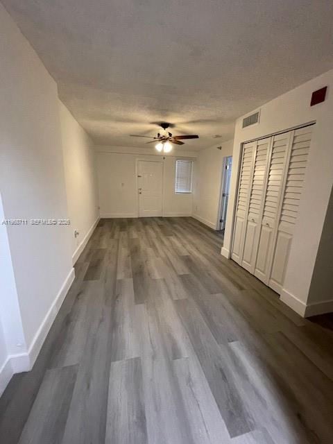 1852 Southwest 7th Street, Unit 203 Miami, FL 33135 - Photo 4 of 16 wooden floor in an empty room with a window