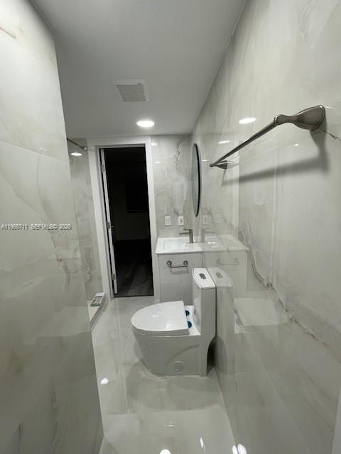 1852 Southwest 7th Street, Unit 203 Miami, FL 33135 - Photo 9 of 16 a bathroom with a sink toilet and shower