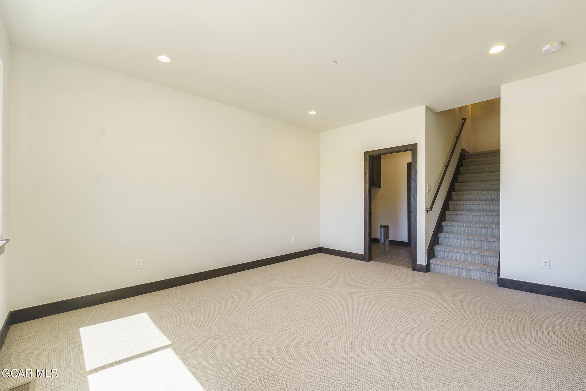127 Homestead Loop Fraser, CO 80442 - Photo 15 of 22 a view of an empty room with wooden floor