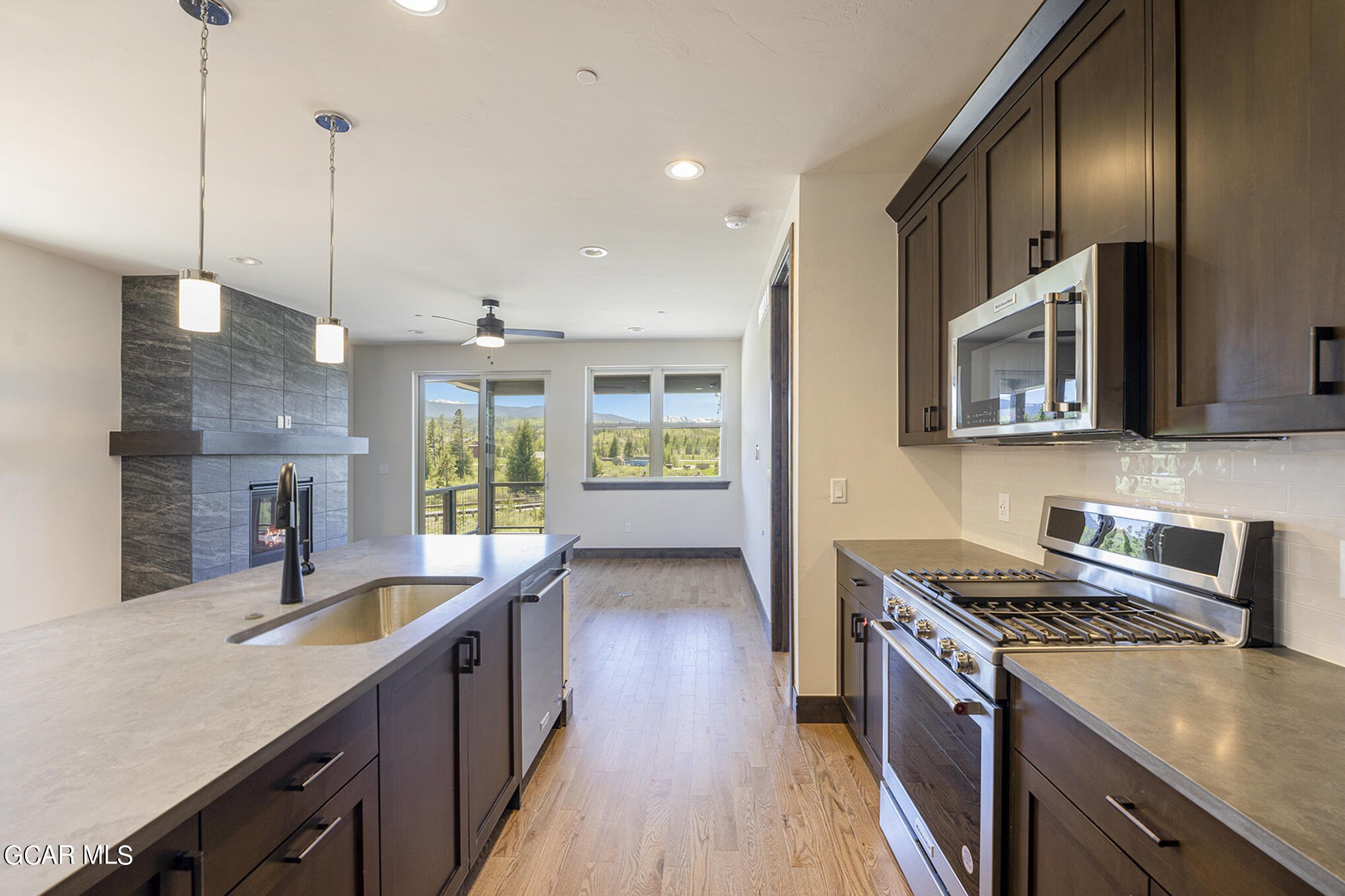 127 Homestead Loop Fraser, CO 80442 - Photo 8 of 22 a kitchen with counter top space and wooden floor