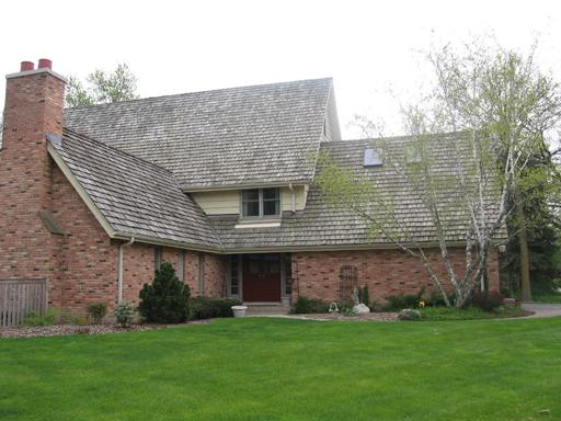 99 Wagner Road Northfield, IL 60093 - Photo 1 of 1 a front view of a house with a garden