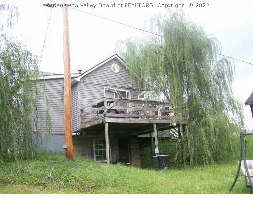 414 Peach Ridge Road Hurricane, WV 25526 - Photo 2 of 8 Exterior Front. The back has a deck and you can see the pond.