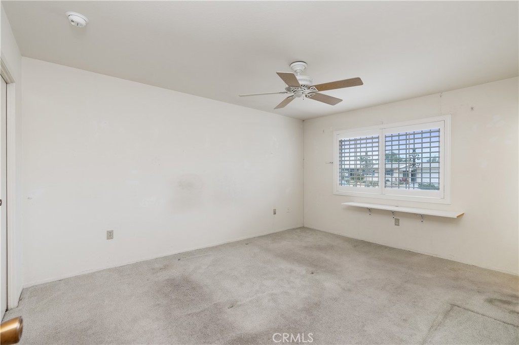 28121 Pebble Beach Drive Menifee, CA 92586 - Photo 17 of 35 a view of an empty room with a window