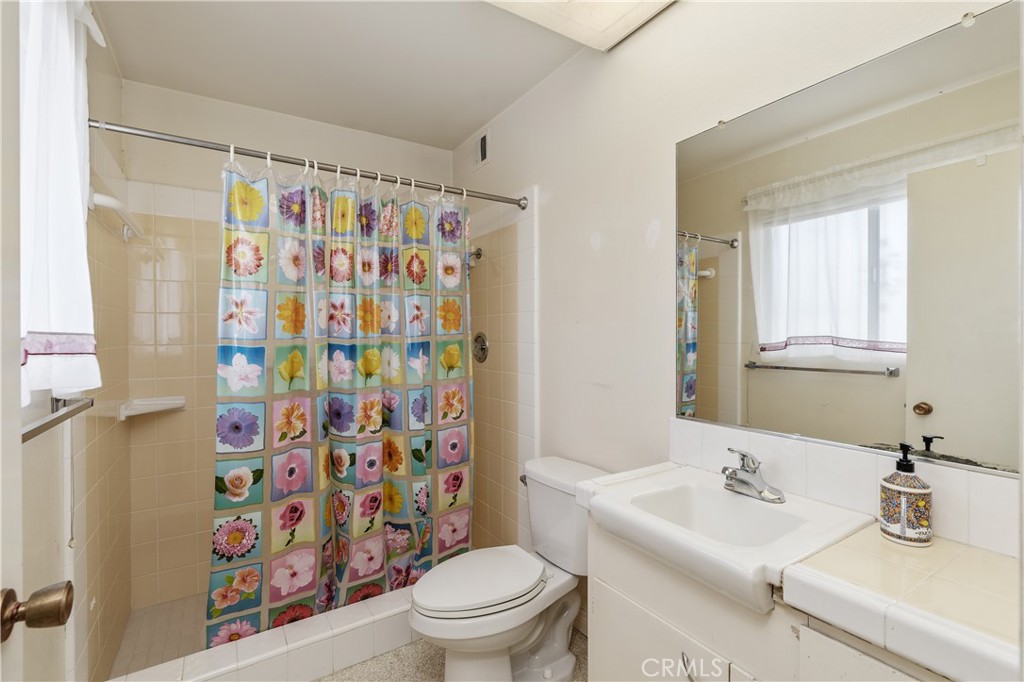 28121 Pebble Beach Drive Menifee, CA 92586 - Photo 19 of 35 a bathroom with a sink toilet and shower