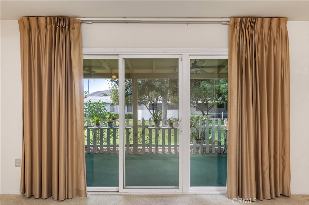 28121 Pebble Beach Drive Menifee, CA 92586 - Photo 20 of 35 a view of a porch with a door