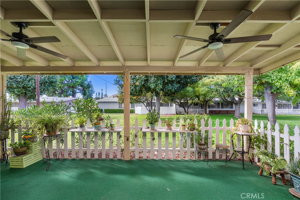 28121 Pebble Beach Drive Menifee, CA 92586 - Photo 21 of 35 a view of a chair and table in backyard