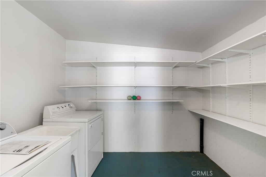 28121 Pebble Beach Drive Menifee, CA 92586 - Photo 23 of 35 a view of storage and utility room with washer and dryer