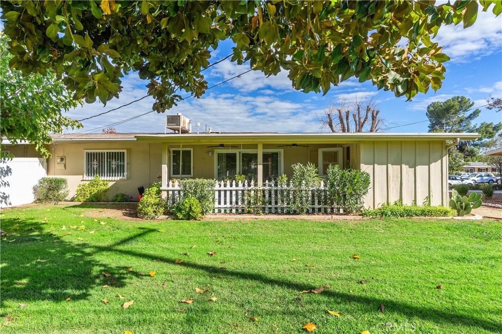 28121 Pebble Beach Drive Menifee, CA 92586 - Photo 24 of 35 a view of a house with a yard and a garden