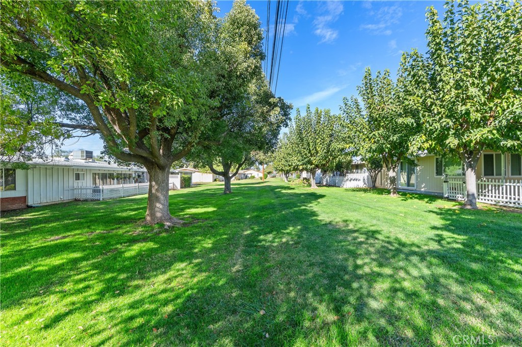 28121 Pebble Beach Drive Menifee, CA 92586 - Photo 26 of 35 a view of green field with trees in the background