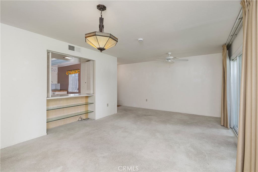 28121 Pebble Beach Drive Menifee, CA 92586 - Photo 9 of 35 wooden floor in an empty room with a window