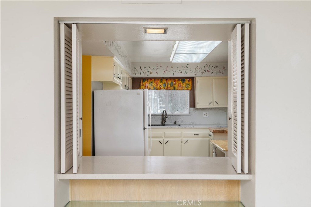28121 Pebble Beach Drive Menifee, CA 92586 - Photo 10 of 35 a bathroom with a sink a mirror and a bathtub