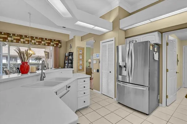 a kitchen with stainless steel appliances a refrigerator and a sink