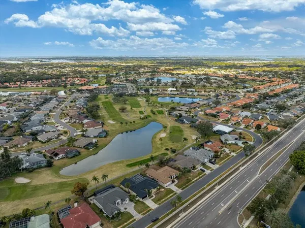 an aerial view of residential houses with outdoor space