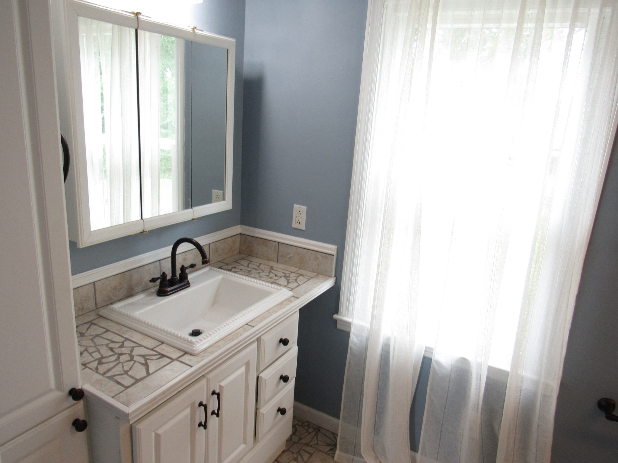 2027 Hidden Cove Road Mount Juliet, TN 37122 - Photo 16 of 25 a bathroom with a sink and a mirror