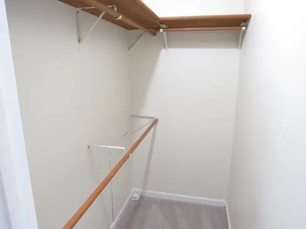 a view of entryway with a chandelier fan