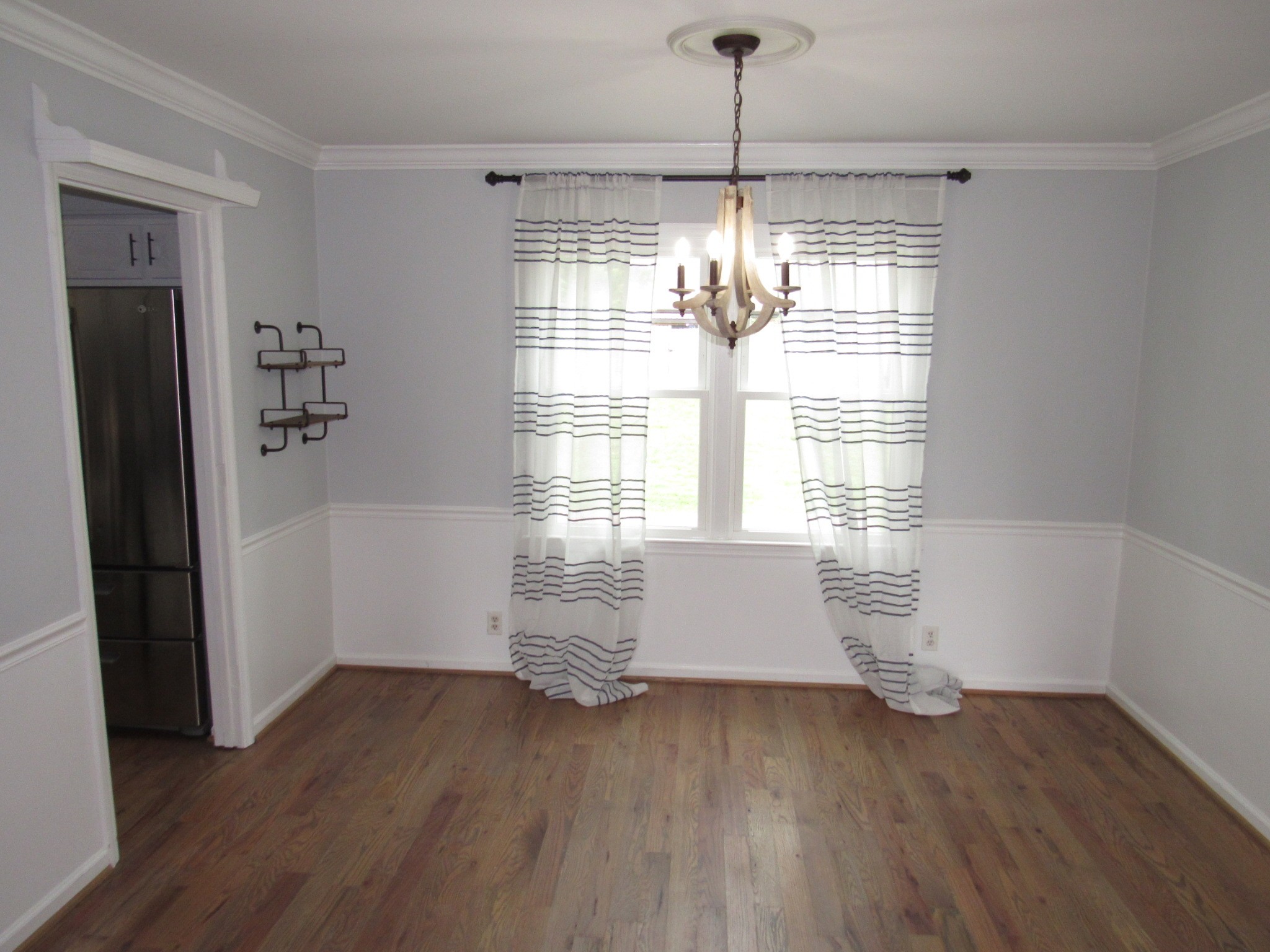 2027 Hidden Cove Road Mount Juliet, TN 37122 - Photo 3 of 25 a room with window and wooden floor