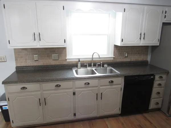 a kitchen with appliances and cabinets
