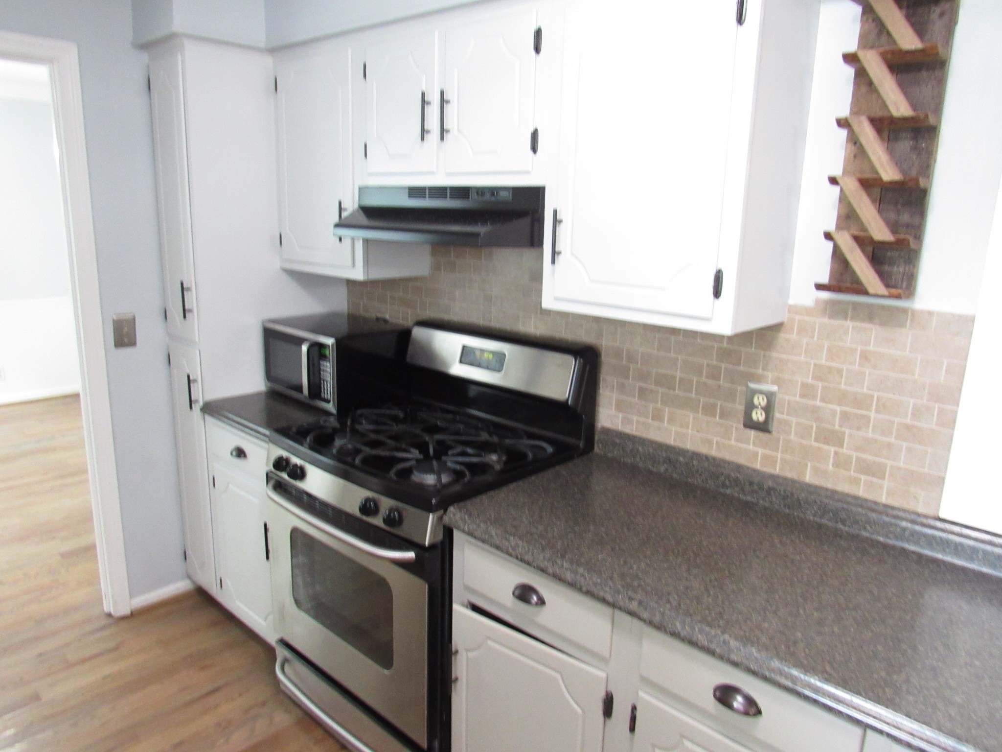 2027 Hidden Cove Road Mount Juliet, TN 37122 - Photo 10 of 25 a stove top oven sitting inside of a kitchen