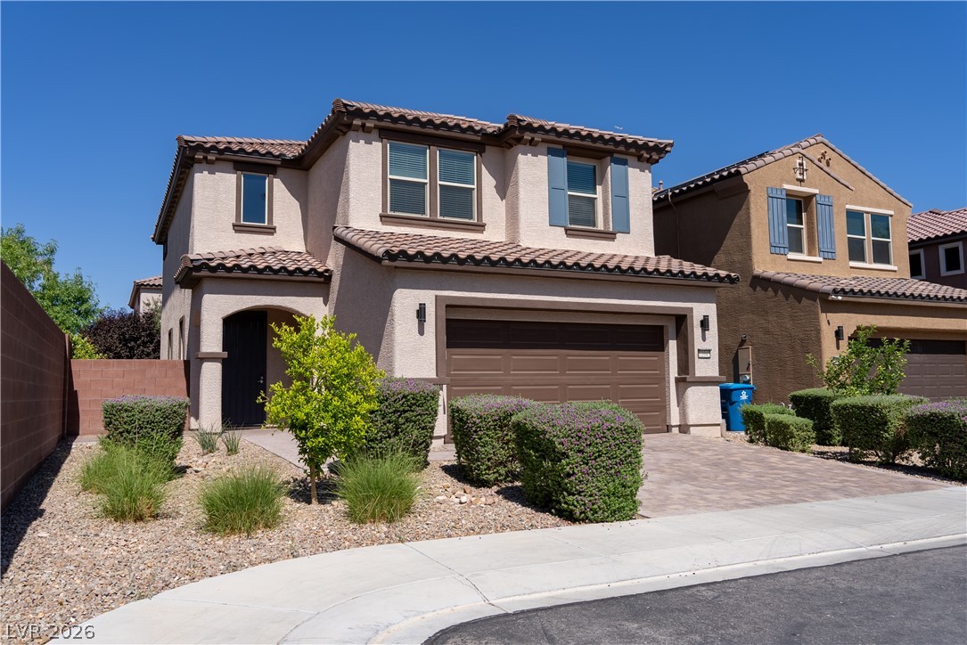 11045 Elk Sands Road Las Vegas, NV 89179 - Photo 44 of 67 A classic Spanish tile roof and desert-friendly landscaping accent the handsome exterior.