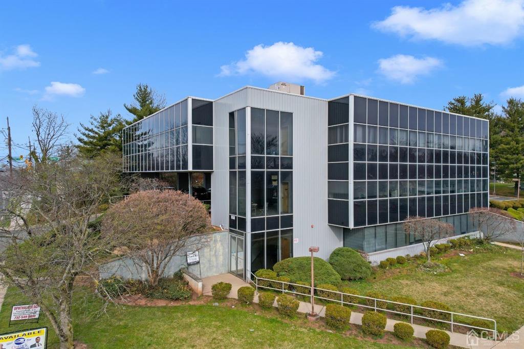 1656 Oak Tree Road, Unit 2 Edison, NJ 08820 - Photo 1 of 19 a front view of a house with a yard