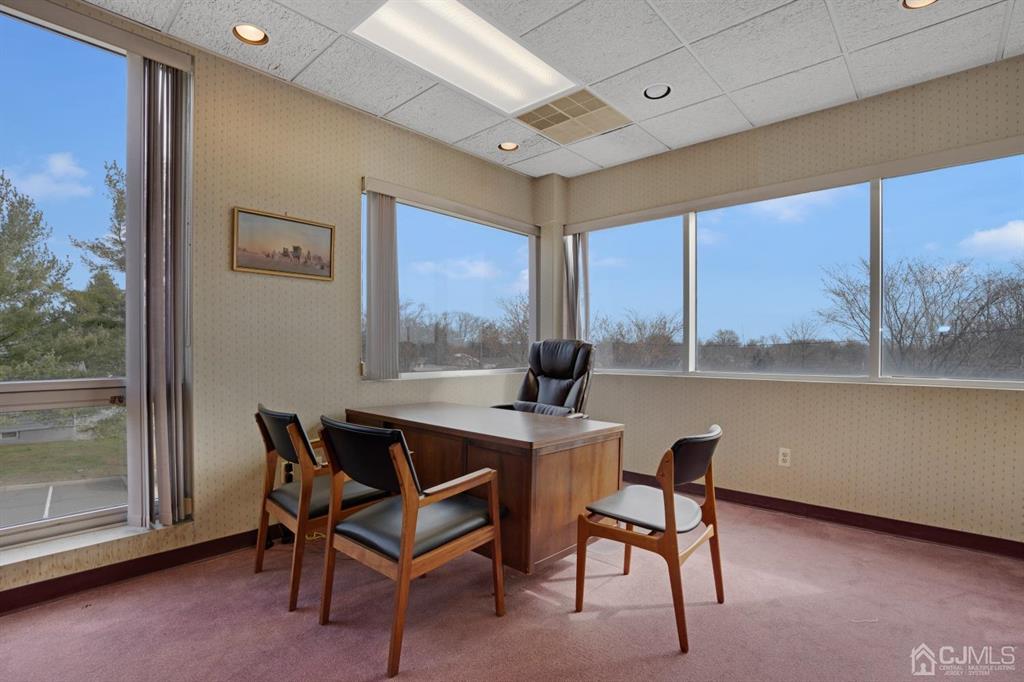 1656 Oak Tree Road, Unit 2 Edison, NJ 08820 - Photo 11 of 19 a view of a dining room with furniture window and outside view