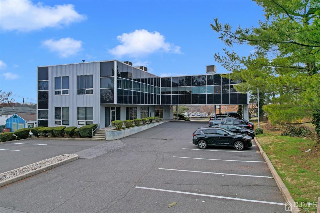 1656 Oak Tree Road, Unit 2 Edison, NJ 08820 - Photo 3 of 19 a car parked in front of a building