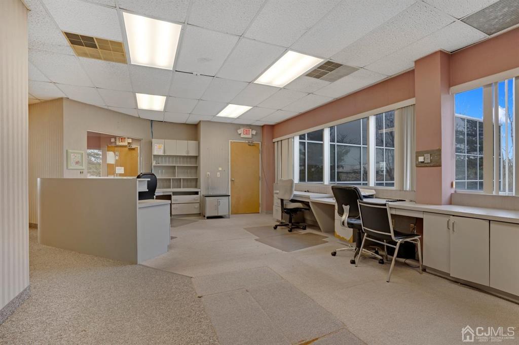 1656 Oak Tree Road, Unit 2 Edison, NJ 08820 - Photo 10 of 19 a view of a workspace with furniture and a window