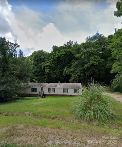 a view of a house with a big yard