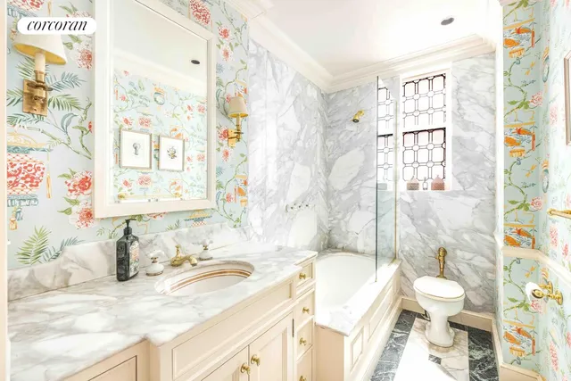 a bedroom with a bed and a bookshelf