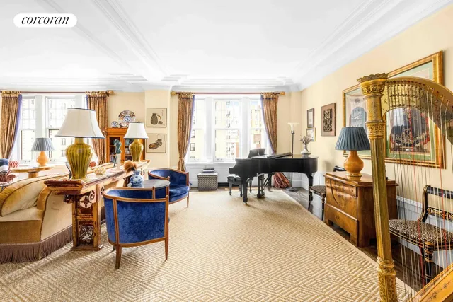 a living room with furniture stove and a window