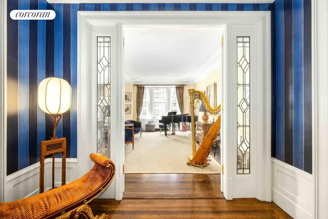 a view of a livingroom with furniture and a mirror