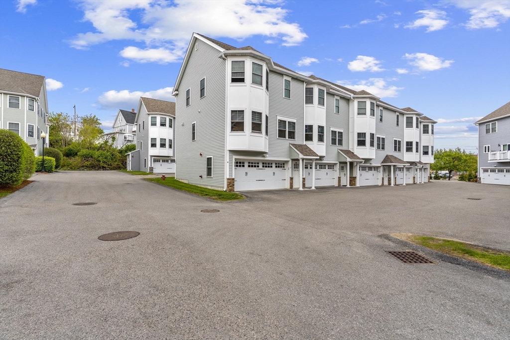 50 Des Moines Road, Unit H1 Quincy, MA 02169 - Photo 30 of 40 a view of a house with a patio