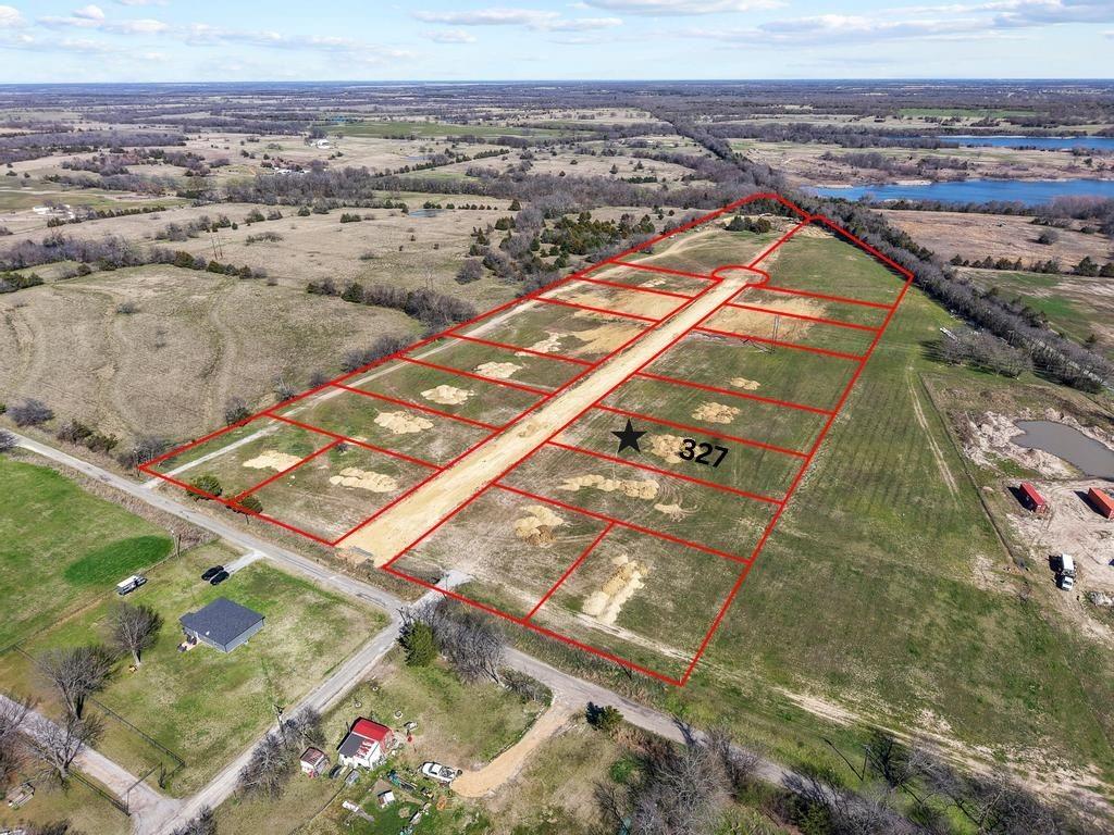 327 Roundtree Circle Wolfe City, TX 75496 - Photo 1 of 11 an aerial view of residential houses with outdoor space